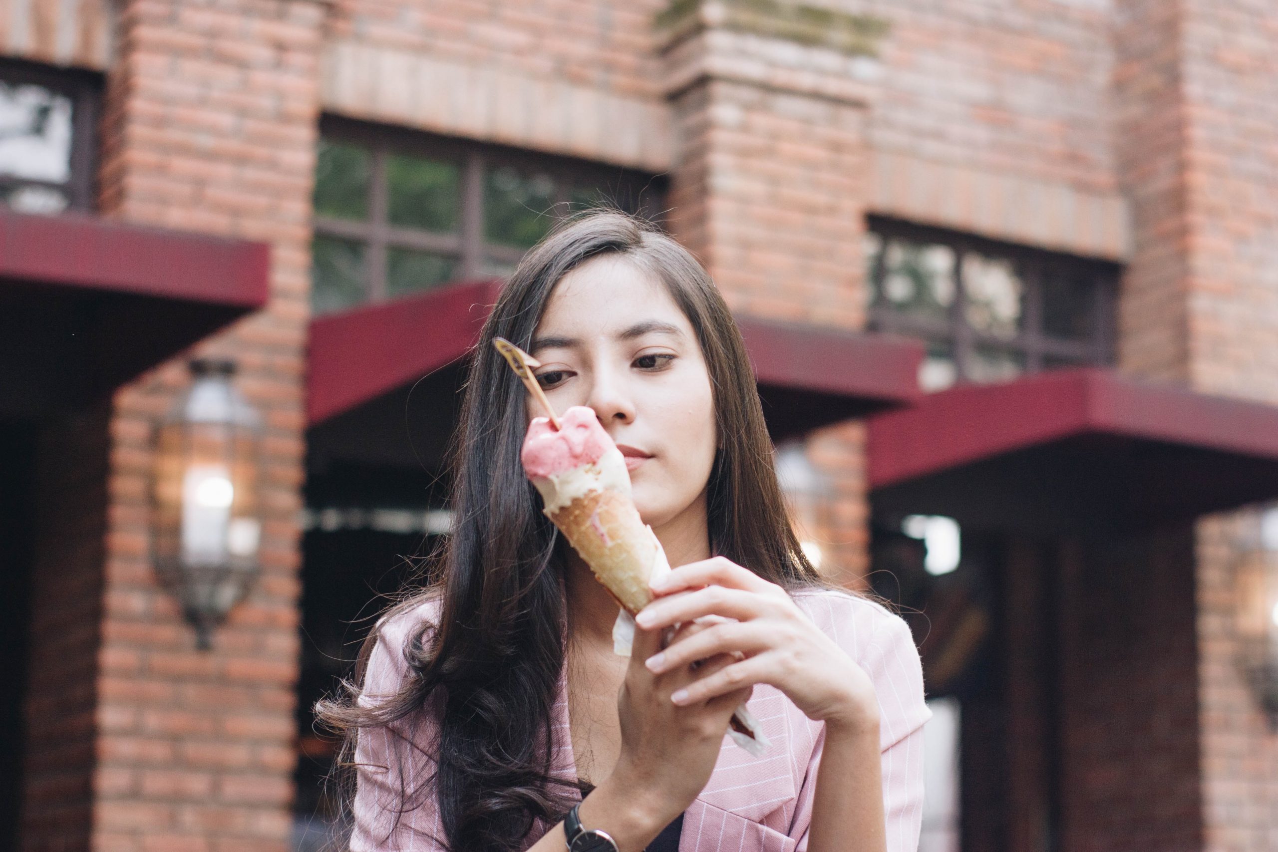 woman holding ice cream cone
