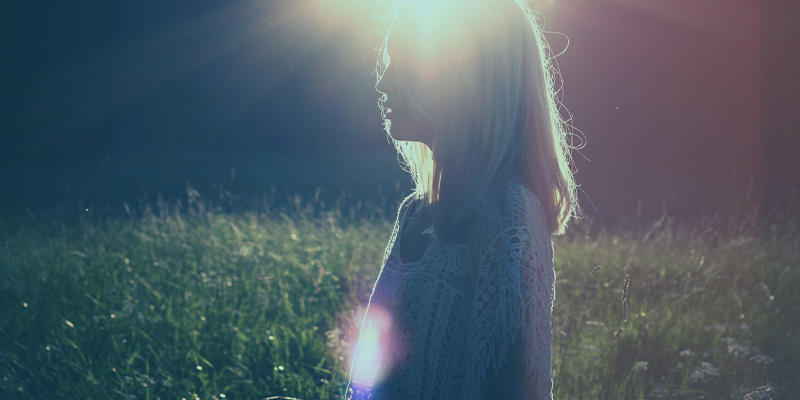 Woman standing in the sun